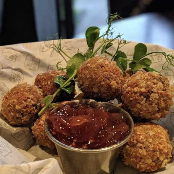 Haggis Bon bons in a crispy panko and oat crumb, served with festive chutney