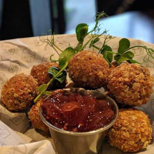 Haggis Bon bons in a crispy panko and oat crumb, served with festive chutney